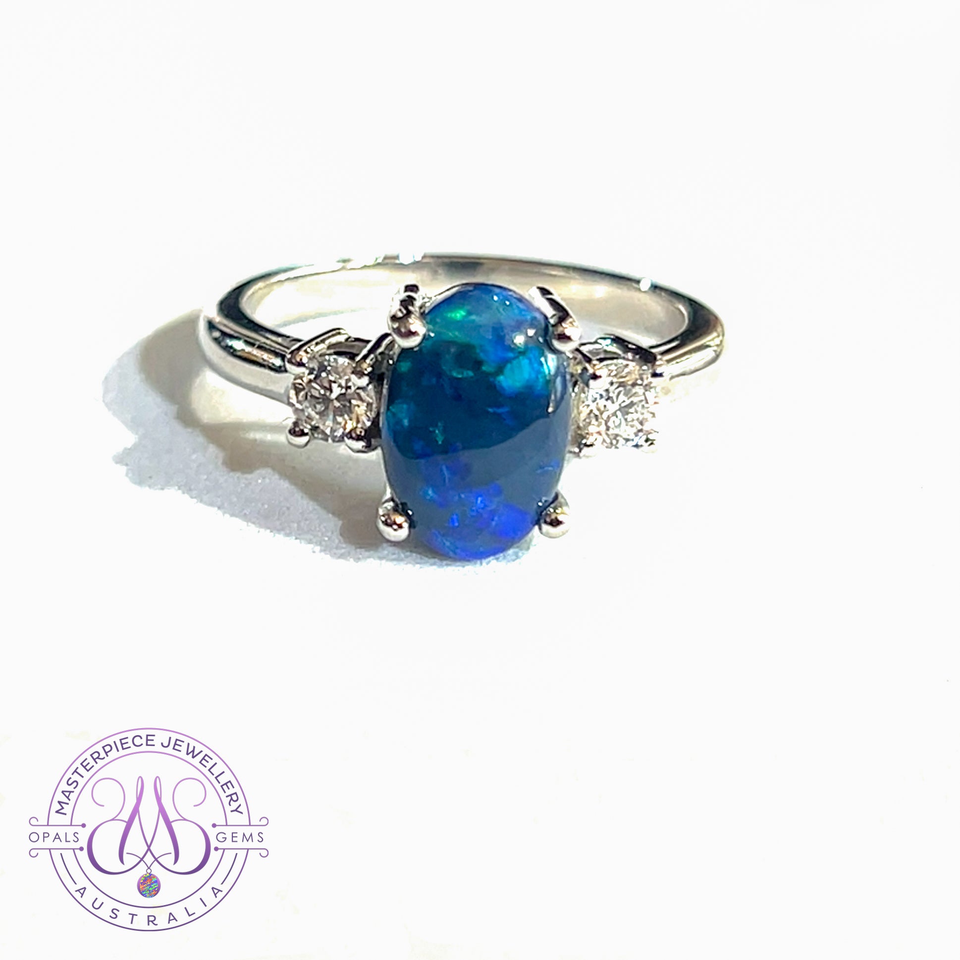 Platinum Black Opal and Diamond trilogy ring