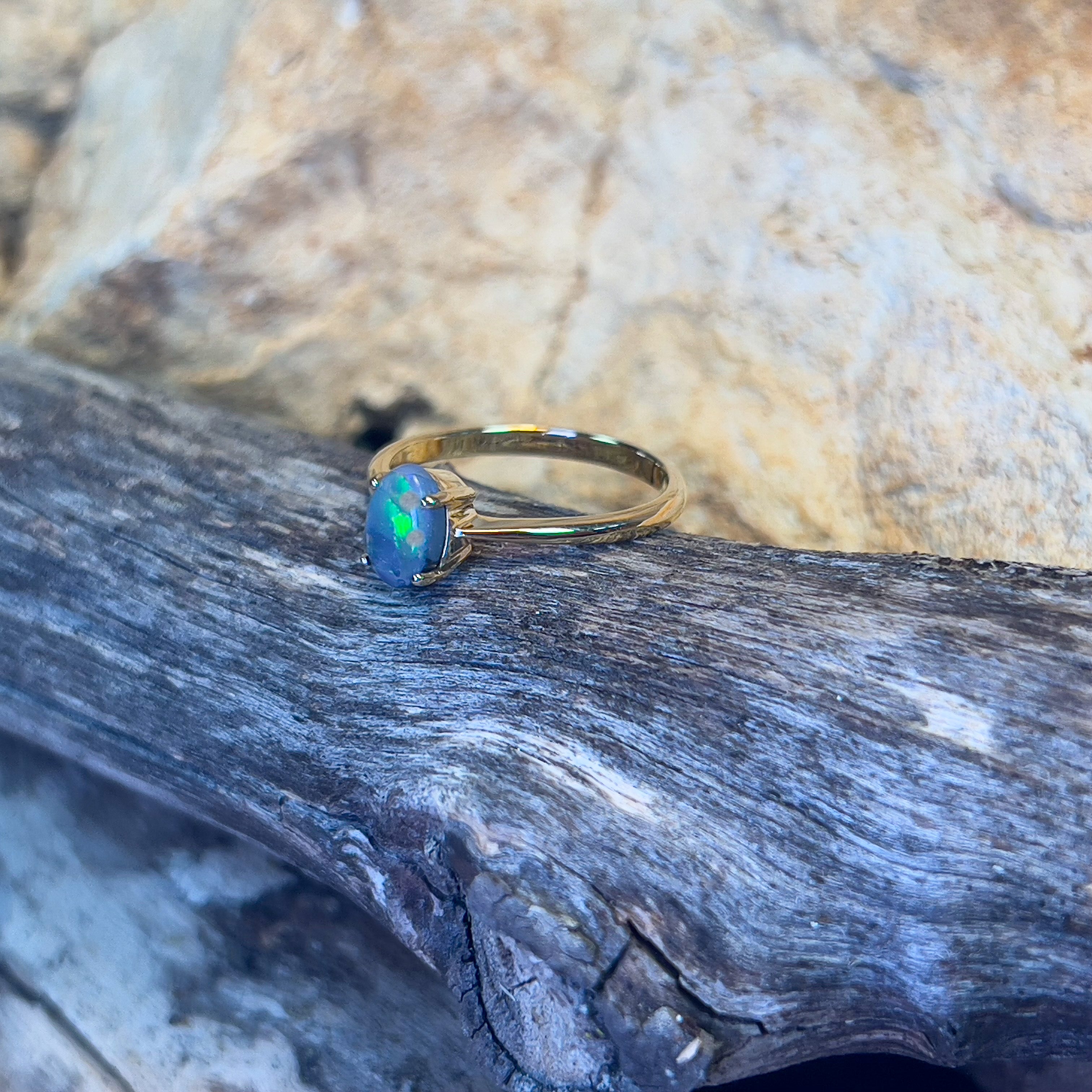 18kt Yellow Gold solitaire ring set with one 0.65ct Black Opal - Masterpiece Jewellery Opal & Gems Sydney Australia | Online Shop